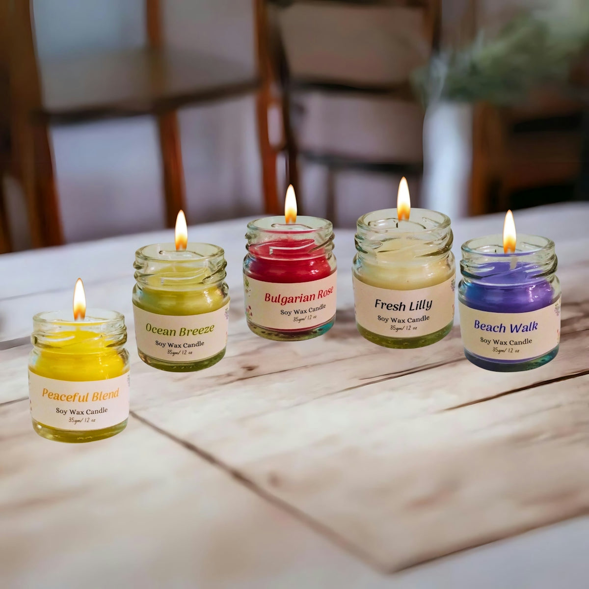 A group of candles sitting on top of a wooden table