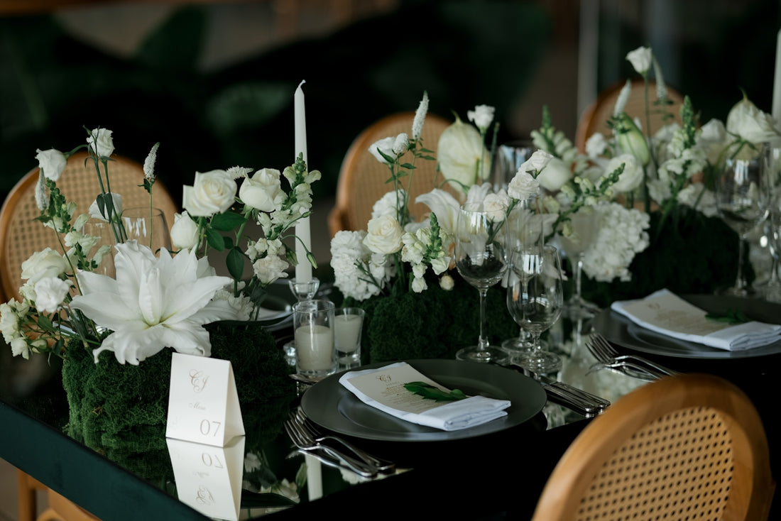 Elegant table setting with white flowers and candles