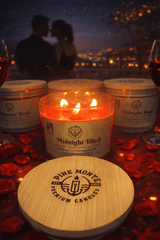 Midnight Blush Soy Candle lit on a romantic table with rose petals, featuring a couple silhouetted in the background.