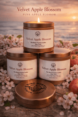 Velvet Apple Blossom Soy Candle displayed in elegant surroundings with floral elements and a calming beach backdrop.