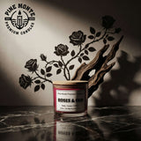 Roses & Oud Soy Candle displayed with elegant shadow art, showcasing its luxurious floral woody scent.